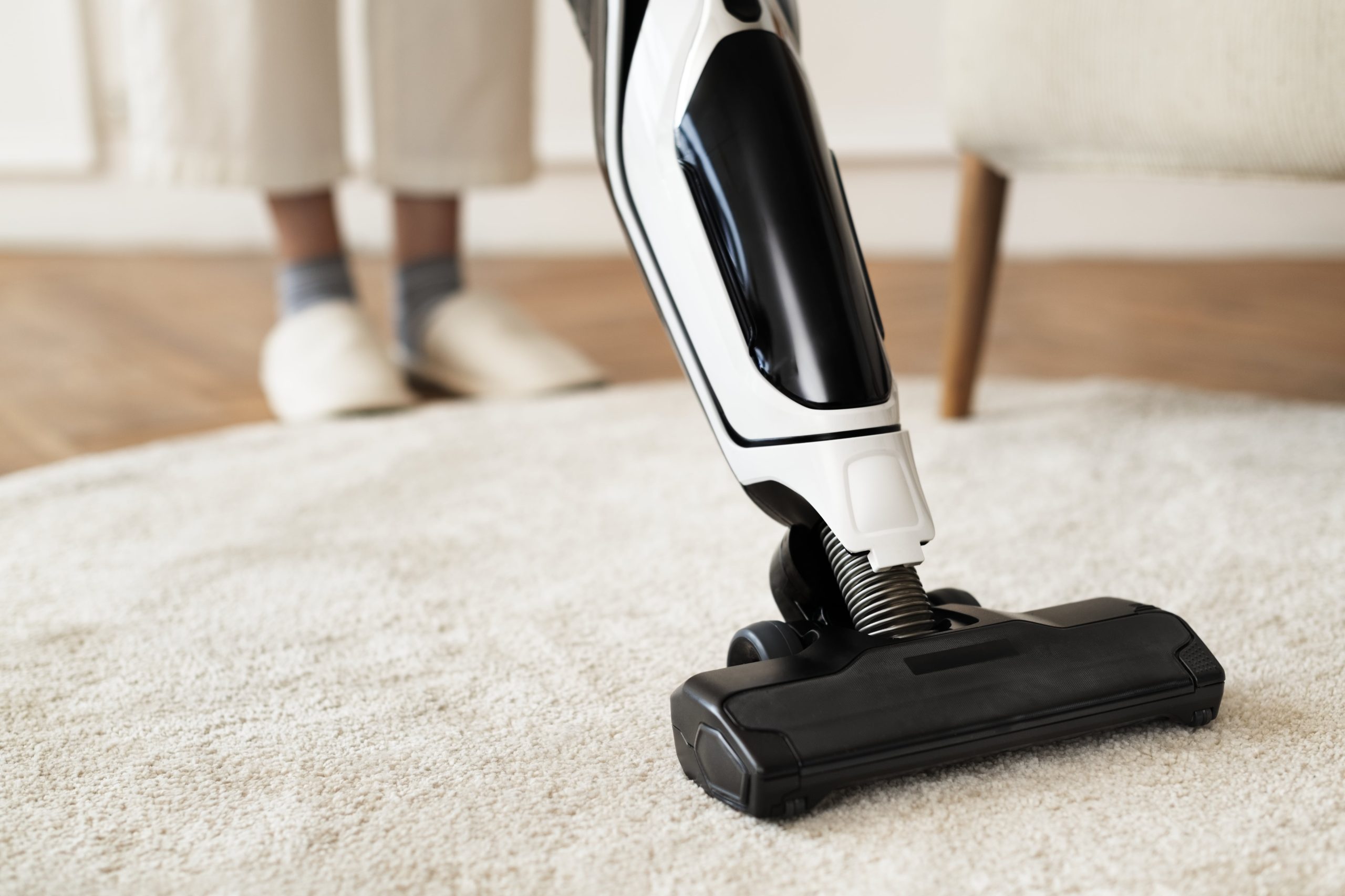 Vacuum cleaning a rug floor - sewing machine repair Boca Raton FL
