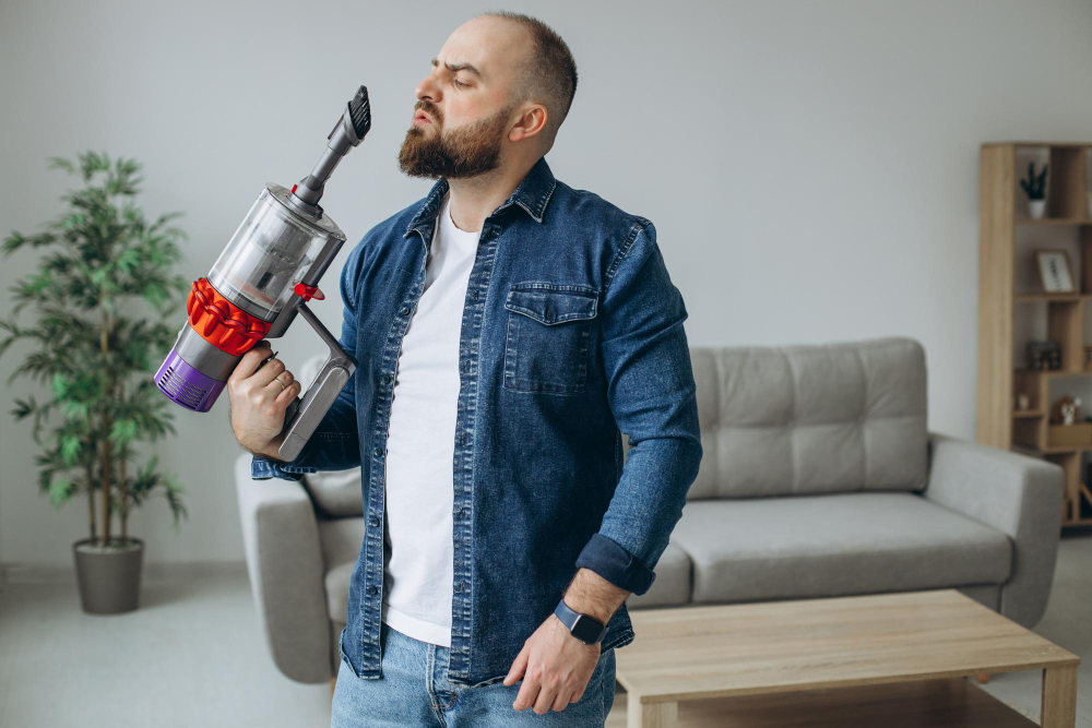a man handling vacuum 