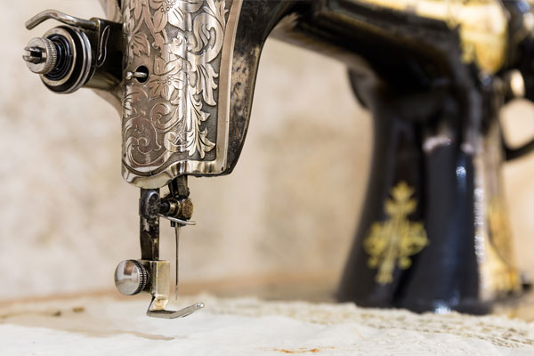 Modern sewing machine close-up showing precision engineering and professional repair components